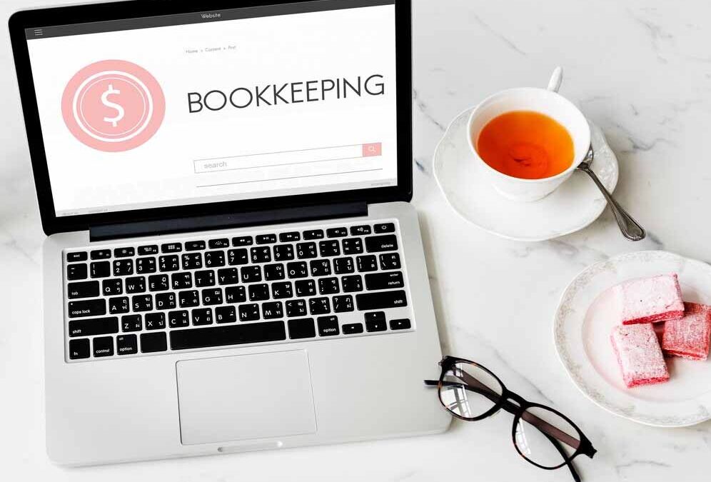 Laptop displaying bookkeeping software on a desk, representing organised financial management for business owners.